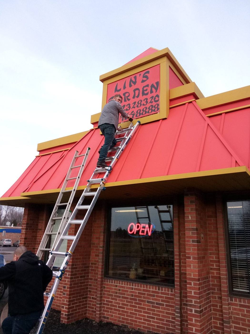 Ladder against Lin's Garden restaurant during painting